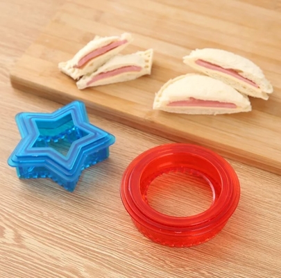 Gli strumenti della cucina agglutinano la taglierina ed il sigillatore del panino del pranzo del biscotto del creatore DIY