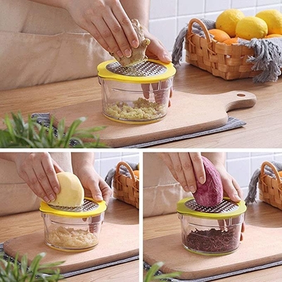 La cucina in serie manuale fornisce agli spremiagrumi arancio dello spremitoio del limone la grattugia della tazza di misurazione