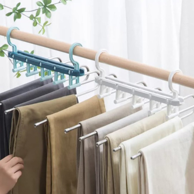 Stendipanni pieganti di plastica del gancio di economia di spazio dell'elettrodomestico per i vestiti
