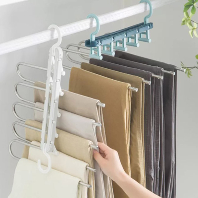 Stendipanni pieganti di plastica del gancio di economia di spazio dell'elettrodomestico per i vestiti