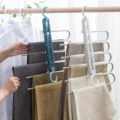Stendipanni pieganti di plastica del gancio di economia di spazio dell'elettrodomestico per i vestiti