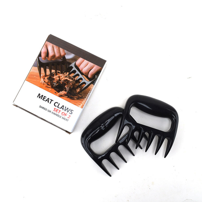 La trinciatrice di plastica all'aperto della carne degli strumenti e degli accessori del BARBECUE graffia l'orso