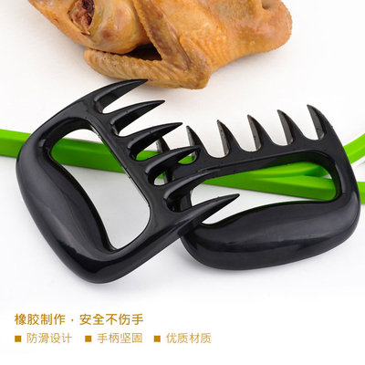 La trinciatrice di plastica all'aperto della carne degli strumenti e degli accessori del BARBECUE graffia l'orso