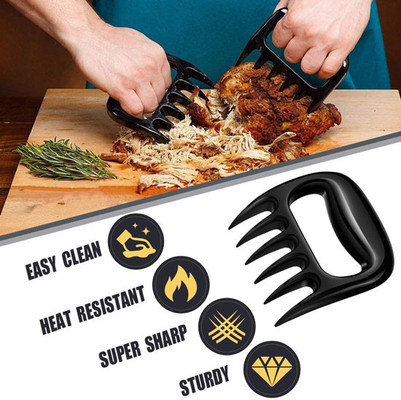 La trinciatrice di plastica all'aperto della carne degli strumenti e degli accessori del BARBECUE graffia l'orso